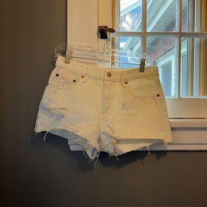 White Levi’s 501 High Rise Jean Shorts w/blue markings - W27